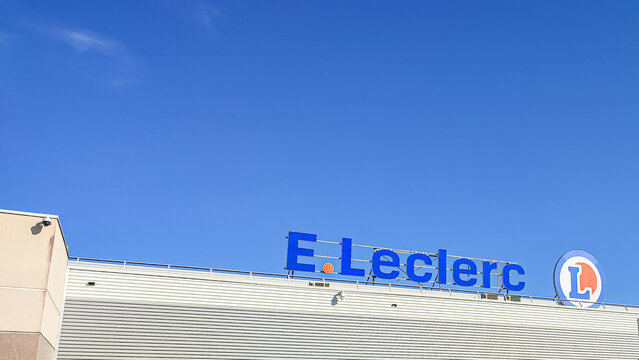 Le Mans, France - April 21, 2026: E. Leclerc supermarket sign against clear blue sky, modern building facade visible in daytime setting