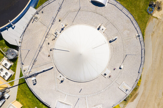 Biogas plant and farm in fields. Renewable energy from biomass. Aerial view to Czech industry. Sustainable development in European Union.	
