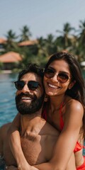 Fototapeta premium Woman perched on man shoulders in resort pool near palm landscape