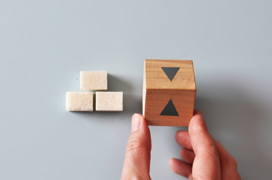 Blood Sugar Increase and Decrease Concept with Cubes and Arrows