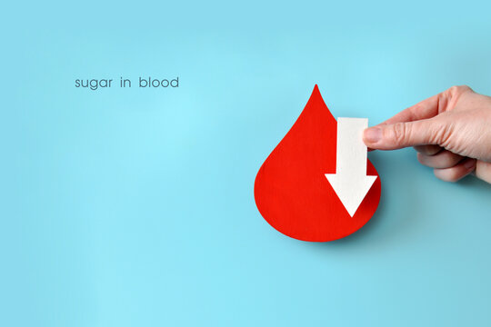 Low Blood Sugar Level Concept with Red Drop and Down Arrow
