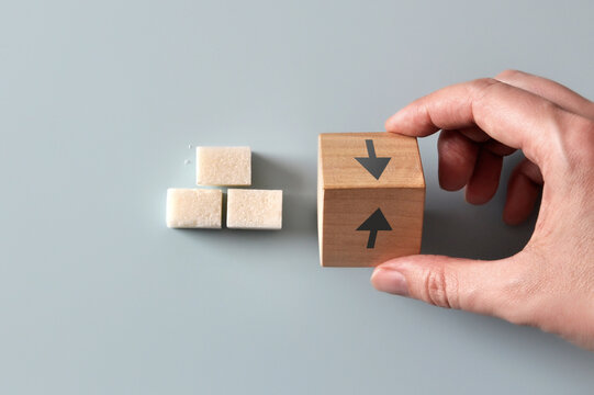 Blood Sugar Increase and Decrease Concept with Cubes and Arrows