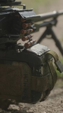 Cinematic shot of soldier preparing for shooting position indoors