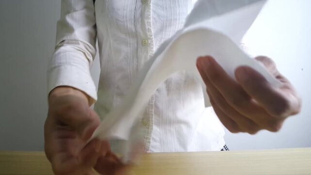 A woman tearing a paper contract