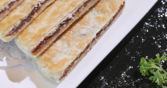 Chinese pastry staple food: flaky pastry with brown sugar and red bean paste filling