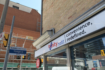 Fototapeta premium exterior building and sign of Infinity Mart, a convenience store chain, located here at 852 Yonge St, Toronto