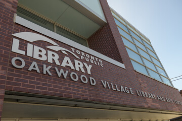 Obraz premium close-up exterior building and sign of Toronto Public Library - Oakwood Village Library and Arts Centre, 341 Oakwood Av