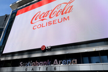 Naklejka premium Coca-Cola Coliseum advertising on the big LG electronic sign outside Scotiabank Arena, Maple Leaf Square/Jurassic Park entrance, Bremner Blvd, Toronto