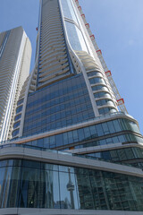 Naklejka premium SkyTower at Pinnacle One Yonge designed by Hariri Pontarini Architects, Toronto (with reflection of CN Tower, at bottom)
