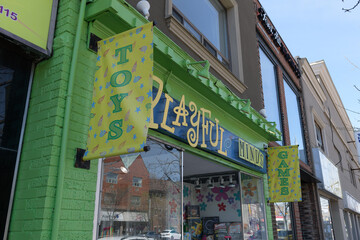 Naklejka premium exterior building facade and sign of Playful Minds, a toy store, located at 657 St Clair Av W, Toronto
