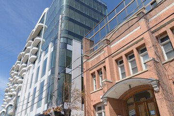 Naklejka premium the ANX at 328 Dupont Street, designed by Teeple Architects for Freed Developments in 2023, is a 13-storey Expressionist Modernist mixed-use condominium characterized by its undulating white aluminum 