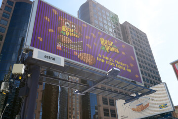 Naklejka premium tri-vision slat billboard with advertising for Bear Paws and Ikea near Bloor St E and Church St, Toronto