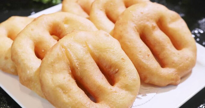 Breakfast pastries: freshly fried golden brown old-fashioned dough cakes