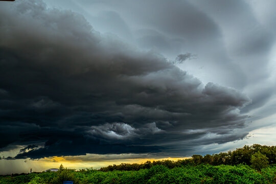 Ominous Storm Front Rolling Over Lush Greenery