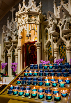 Experience serenity at St Patrick Cathedral in New York with glowing candles