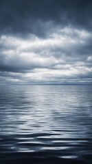 Obraz premium latent. Vast calm ocean under a heavy dramatic sky before a storm, low horizon line. travel magazines, destination branding, designed for travel destination branding, used by architects. 