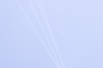 Minimalist Abstract Background of White Paper Layers with Soft Shadows and Texture,Macro,Close-up view of white paper sheets stacked with subtle curved edges, creating a minimalist abstract background © banjongseal324