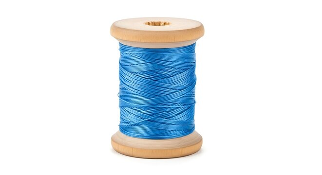 Wooden spool of vibrant blue thread isolated on a white background studio shot