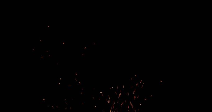 Realistic fire sparks flying through the air in slow motion, isolated on a black background. Perfect as a cinematic VFX overlay, fire particles effect or visual element. Shot in slow motion.