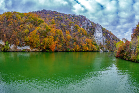 Eselnita, Romania - November 4, 2017: Autumn at the Danube Gorges. View with the Decebal King's Head sculpted in rock and inscription "DECEBALOS REX - DRAGAN FECIT" (Decebal King - Dragan Happy).