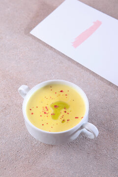 Cream soup made from fresh pumpkin. The concept of an autumn lunch. The menu in the cafe. A dietary and healthy dish.