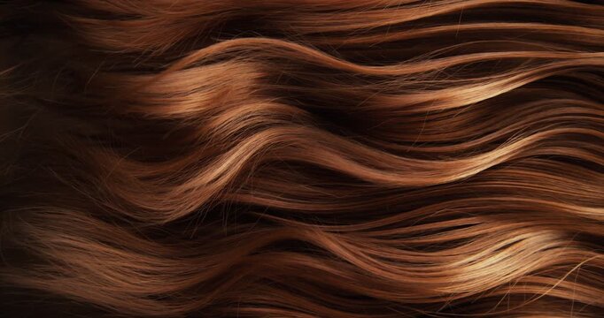 Ultra slow motion shot of dark brown hair flowing in smooth, elegant waves, forming natural curves and motion. Captured at 1000 fps, revealing fine texture, shine, and fluid cinematic movement.