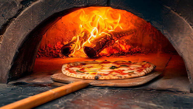 Rustic pizza oven with pizza peel and pizza