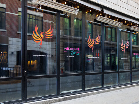 Quebec City, Quebec, Canada, April 26, 2026 - The Midnight Blue Discoth&egrave;que sign on its glassed facade at 441 Du Parvis Street in the Saint-Roch district