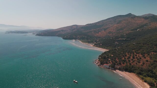 Wide Drone Flight Approaching Sandy Shores of Paralia Kalamaki in Corfu Island Greece