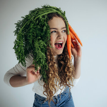 Beautiful young girl with vegetables 