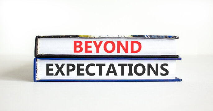 Beyond expectations words symbol. Concept words Beyond expectations on beautiful books. Beautiful white background. Business and Beyond expectations words concept. Copy space.