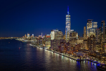 Naklejka premium New York night skyline view. NYC metropolis aerial view at night. New York City panoramic night view of Manhattan. New York skyline at night. NYC skyline view.