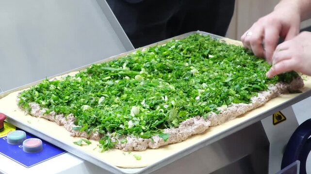 Chef cook is preparing large, delicious pie with vegetable filling for baking. Hands shape pastry with precision. Professional food preparation in kitchen. Ideal for recipes, baking tutorials