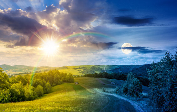 sun and moon over green mountain field. day meet night. countryside landscape on summer solstice with forest on the hill. epic sky. nature harmony concept. open view for rural astrology wallpaper