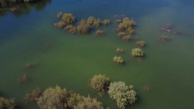 Aerial view flying over colomera reservoir in granada