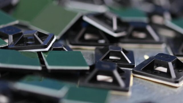 Plastic self-adhesive pad for installing nylon ties.
