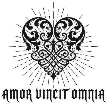 Ornate heart design with rays and text "Amor Vincit Omnia"  