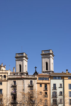 colorful apartments Girona, Spain, sunny day blue sky negative space, vertical