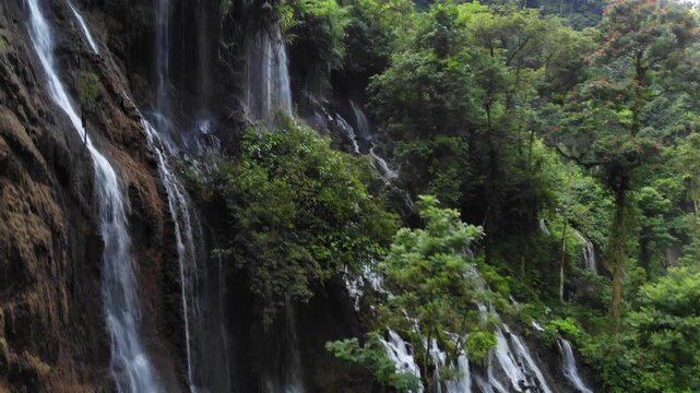 Drone Ascending from Low to High Over Jungle Waterfalls in Tumpak Sewu Complex, Java, Indonesia