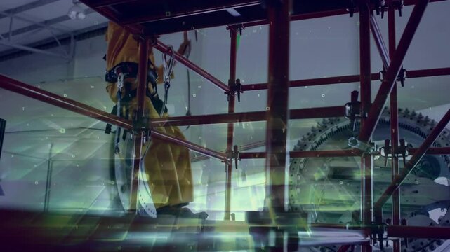 Industrial tech responding to alert, securing tether, inspecting rotor as green overlays drifting