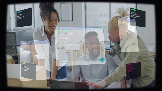 Seated man typing while colleagues pointing at laptop, reviewing software demo overlays loading