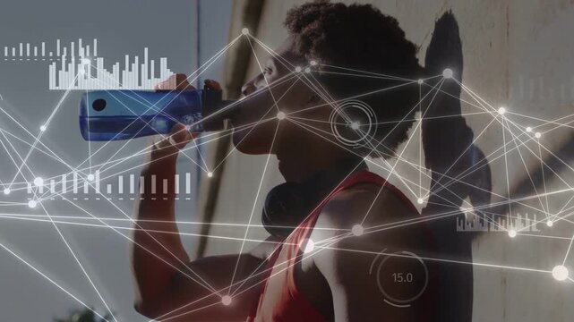 Male athlete pausing after run drinking for health while HUD gauges bar charts overlaying athlete