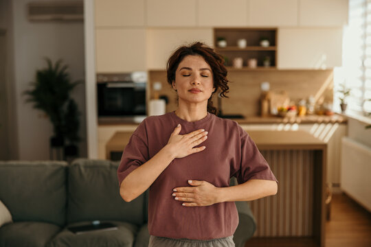 Woman practicing deep breathing for mindfulness and relaxation
