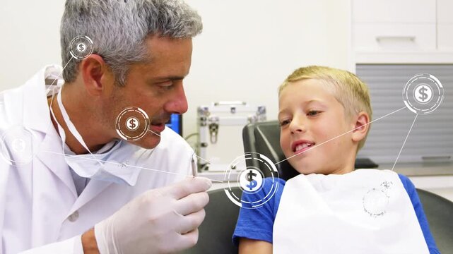 Dentist leaning, holding tool near child, causing HUD dollar graphics forming around mouth for exam