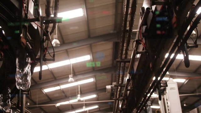 Conveyor starting, rail releasing preforms, elongating and reflecting green readouts for inspection