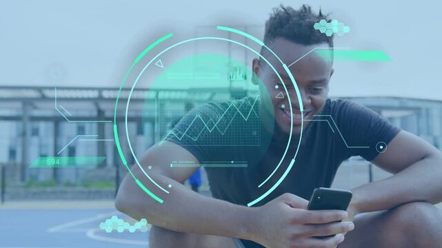 Man crouching on court, tapping phone and checking sports stats with teal HUD overlaying torso