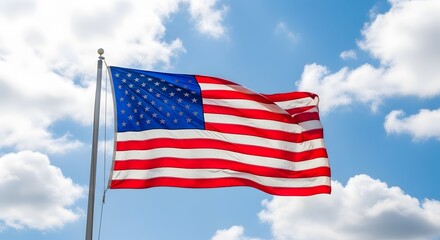 Obraz premium American flag waving in the breeze against a cloudy sky