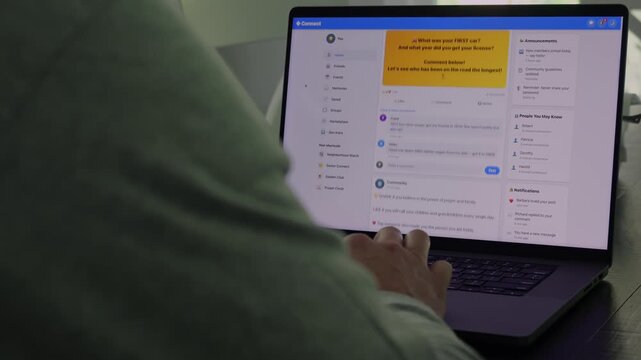 Older man using a laptop to answer social media quiz questions illustrating the dangers of oversharing personal data and cybersecurity risks