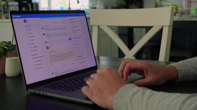 Older man using a laptop to answer social media quiz questions illustrating the dangers of oversharing personal data and cybersecurity risks