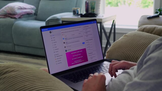 Older man using a laptop to answer social media quiz questions illustrating the dangers of oversharing personal data and cybersecurity risks
